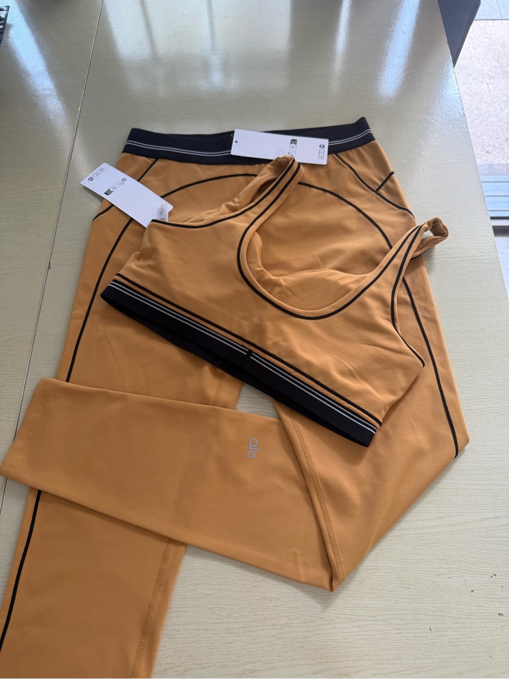 ALO Yoga Tan Sports Bra and Leggings Set with Black Trim - Picture 2 of 2